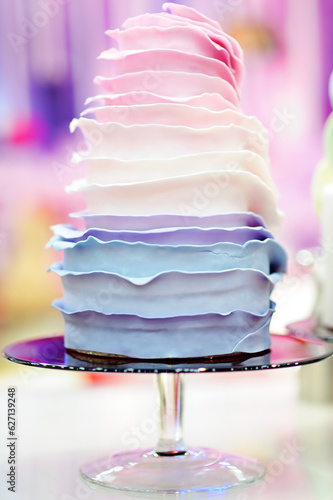 Delicious colorful wedding cake. Baking and selling of unique wedding desserts and sweets to order.