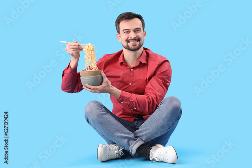 Handsome man with bowl of C...