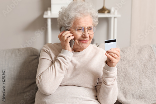 Senior woman with credit ca...