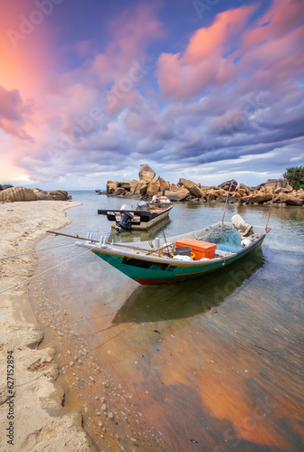 Fishing boat on the beach at Terengganu, Malaysia in the morning sunrise..
