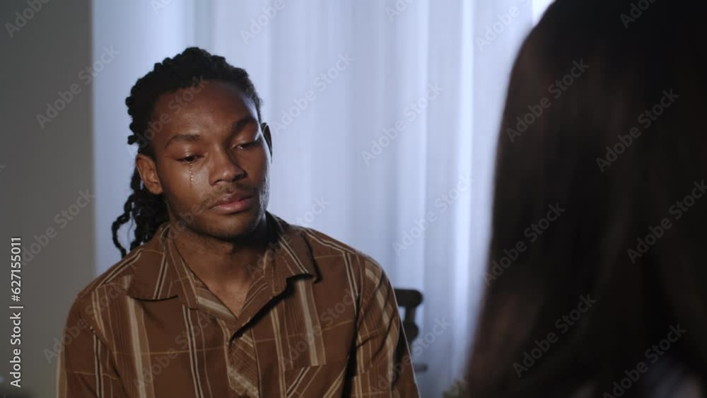 Close Up of an Emotional African Man in Heartfelt Conversation Close Up of an Emotional African Man in Heartfelt Conversation