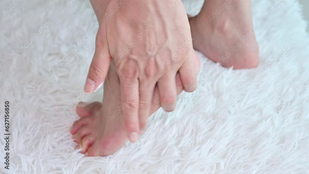 Close up of woman applying moisturizer cream for treat cracked heels problem. Close up of woman applying moisturizer cream for treat cracked heels problem.