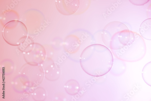 Beautiful Transparent Pink Soap Bubbles Floating in The Air. Abstract Fun Background. Circles, Bubbles Blurred. Refreshing of Soap Sud and Bubbles Water. 