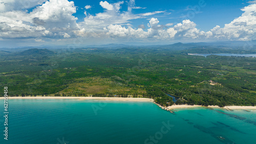 Sandy beach and turquoise water in the tropics. Borneo, Malaysia. photo