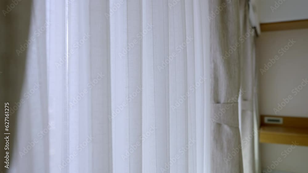 White Plain Curtain On A Glass Window At The Condominium. Reveal White Plain Curtain On A Glass Window At The Condominium. Reveal