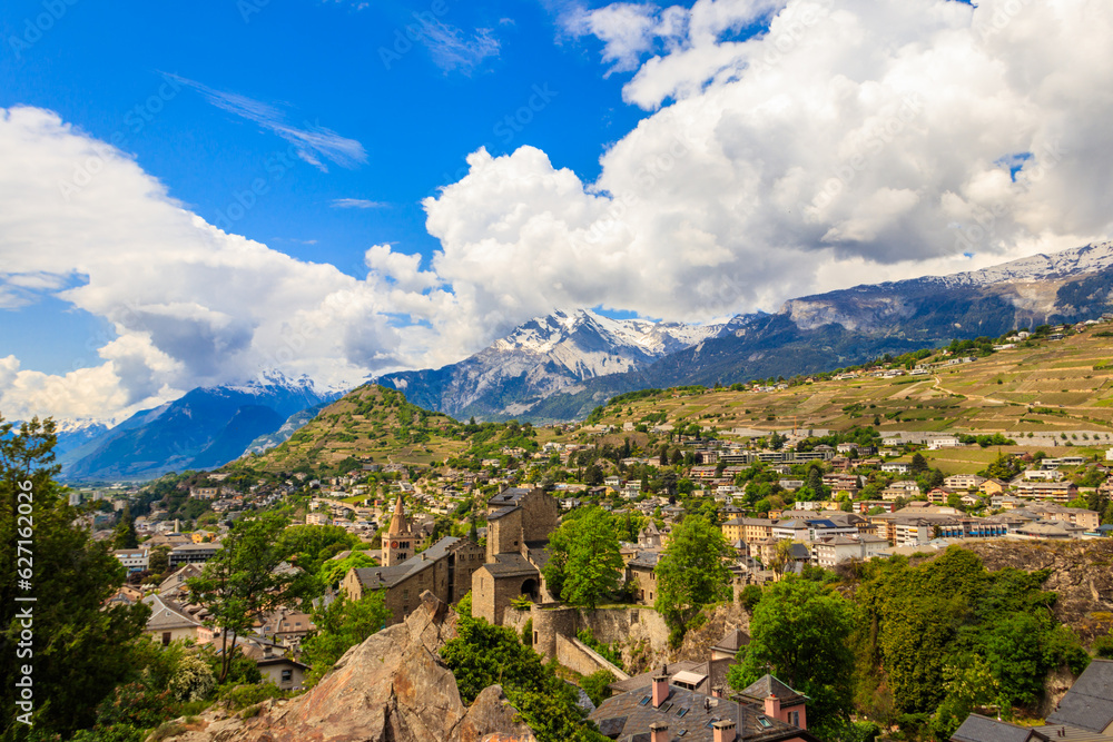 Panoramic view from a hill over City of Sion with and Swiss Alps in Canton Valais, Switzerland