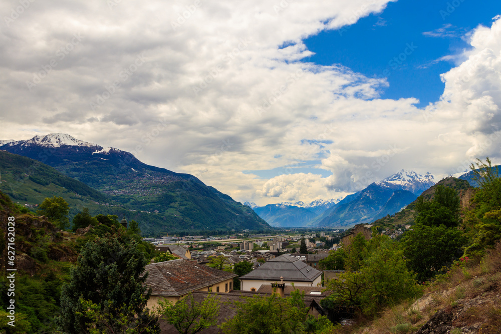 Panoramic view from a hill over City of Sion with and Swiss Alps in Canton Valais, Switzerland