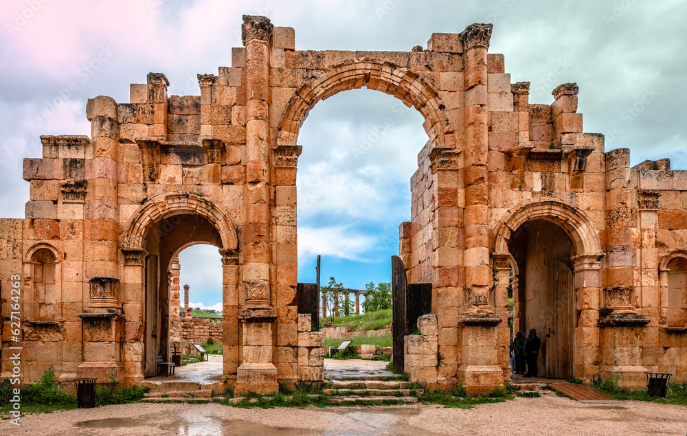 Hadrian’s Arch in Jerash, Jordan. Built in 129AD, this gate marks the ancient city’s boundaries. The ruins of the old city is in the background.