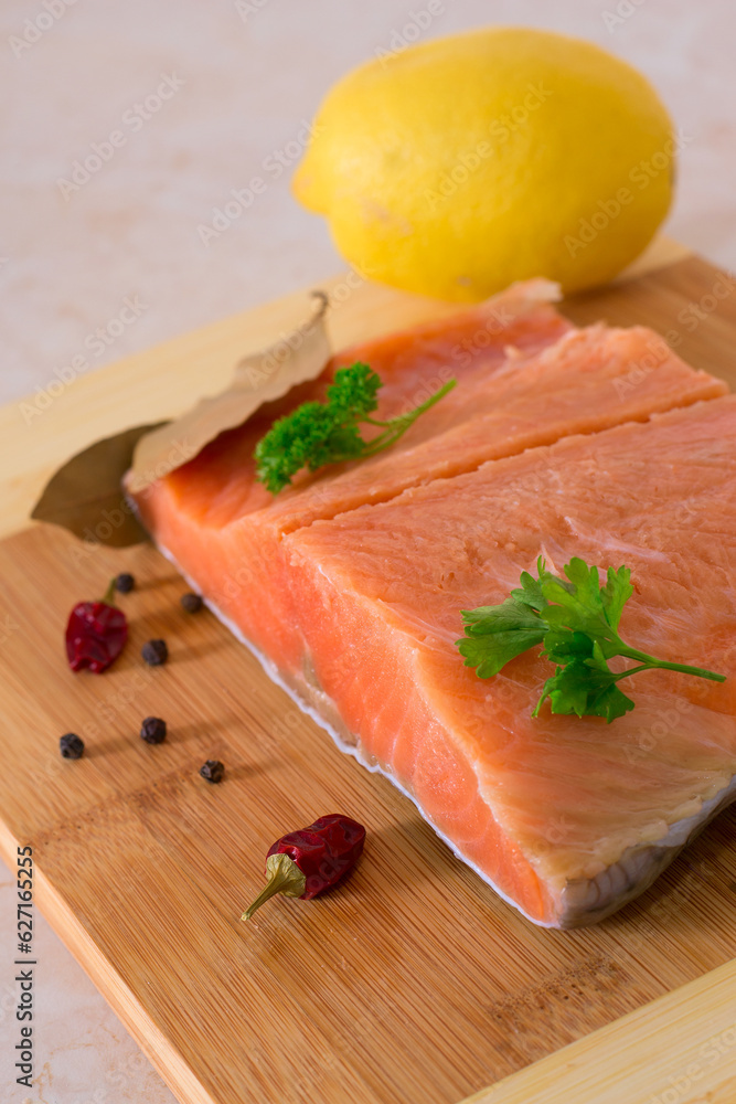 Trout, salmon fillet on wooden background .