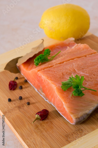 Trout, salmon fillet on wooden background .