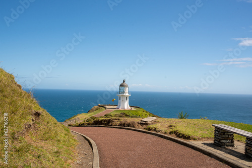 The spot where the Tasman sea and Pacific oceans meet at Cape Reinga and its historic lighthouse 