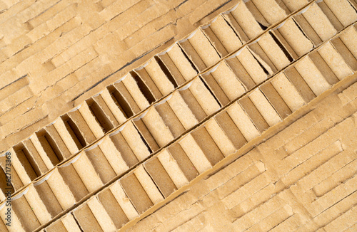 Corrugated Cardboard Edge Layers Textured Background. Carton Cut Slices Pattern with Copy Space