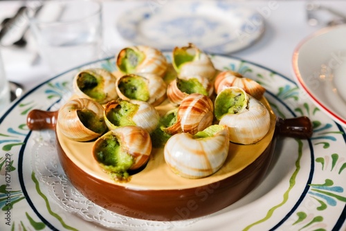 A plate of garlic and parsley butter escargot at a French bistro in Circular Quay, Sydney — New South Wales, Australia