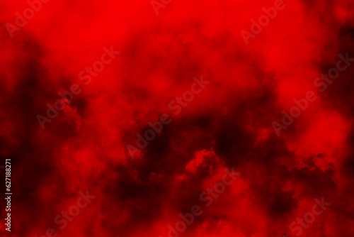 Abstract red smoke mist fog on a black background. Red Smoke on a black background. Cloudiness, mist or smog background. Red fog and smoke effect. Clouds of smoke or gas. Texture. Design element.