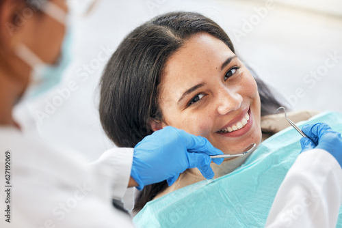 Dentist  dental care and teeth smile of a woman with tools and hands of a professional by mouth. Portrait of a female patient for orthodontics  healthcare and cleaning or inspection for oral health
