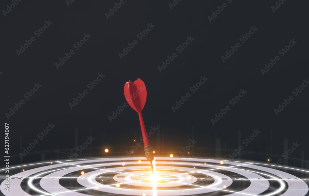 red dart aiming precisely at the center of the target board.
red dart aiming precisely at the center of the target board.