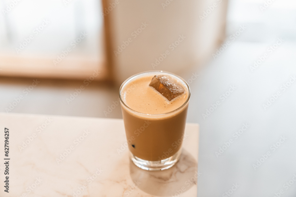 Glass of ice coffee on the counter bar in cafe Glass of ice coffee on the counter bar in cafe