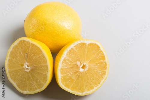 Group of ripe lemons on the light background