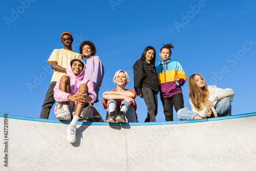 Multiracial group of young friends bonding outdoors