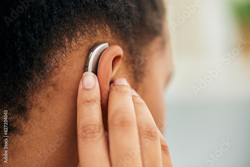Bild auf Leinwand Closeup of ear, hearing aid and person disability from the back for medical support, listening and healthcare technology