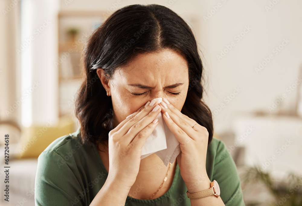 Tissue, nose and sick woman sneezing on a sofa with allergy, cold or flu in her home. Hay fever, allergy and female with viral infection, problem or health crisis in a living room with congestion Tissue, nose and sick woman sneezing on a sofa with allergy, cold or flu in her home. Hay fever, allergy and female with viral infection, problem or health crisis in a living room with congestion
