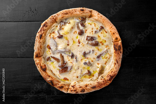 Valokuva Top view of pizza with cheese sauce and fried forest mushrooms