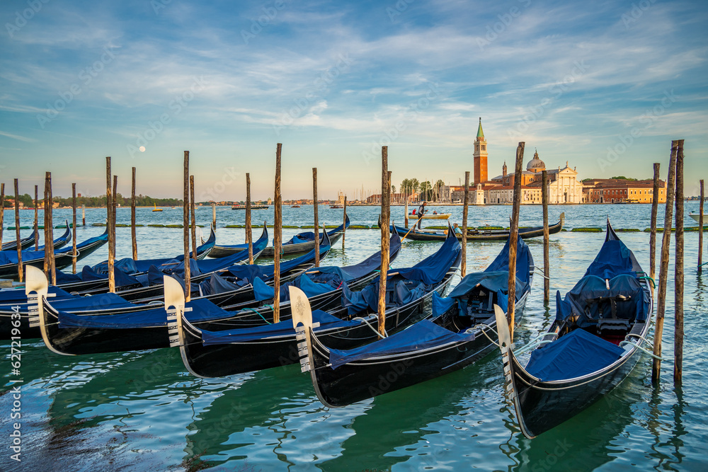 Gondolas are the symbol of Venice and the San Giorgio Maggiore church in the back