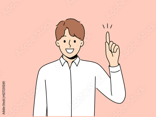 Man raises finger and says there is idea or advice to solve difficult problem. Smiling guy in white shirt points up and looking at screen, sharing brilliant idea for success or career growth