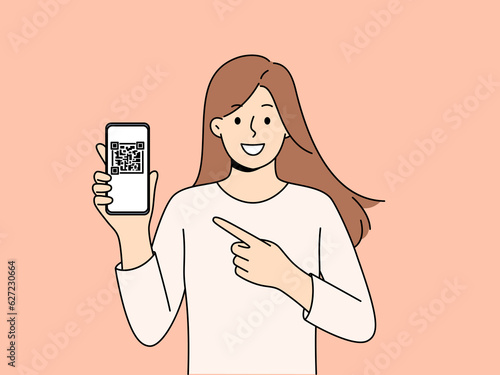 Woman holds phone demonstrating QR code for exchanging contacts or confirming online money transfer. Young long-haired girl with smartphone recommends using QR technology in mobile gadgets