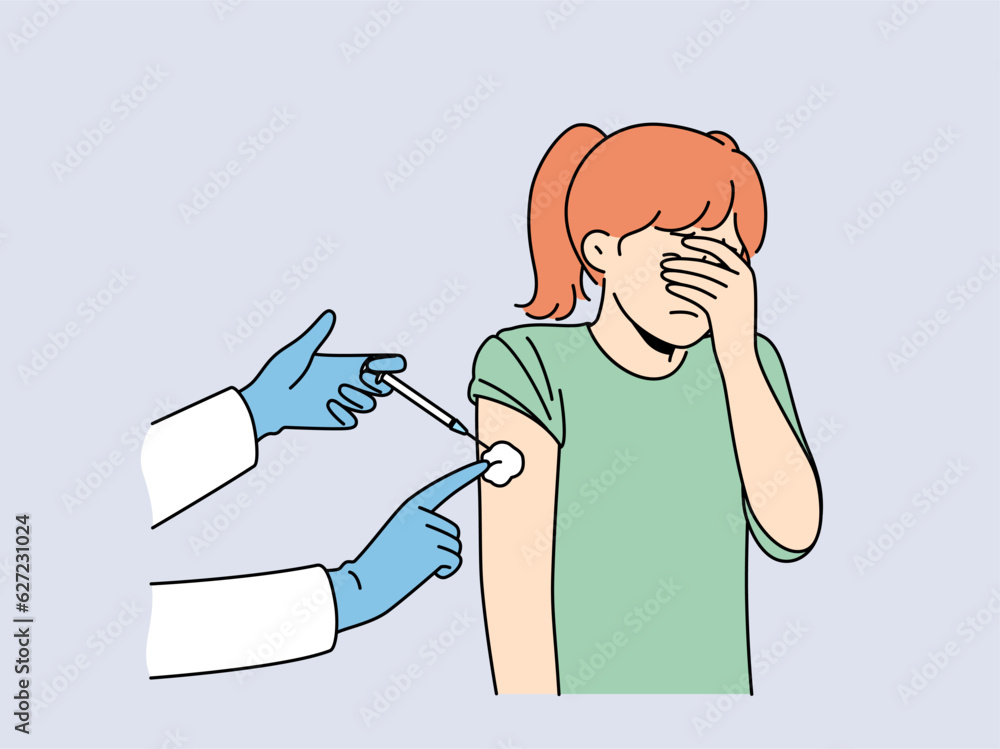 Crying little girl is afraid of injections and closes eyes during injection in shoulder and vaccination against measles or flu. Hands of doctor with syringe making injection to child Crying little girl is afraid of injections and closes eyes during injection in shoulder and vaccination against measles or flu. Hands of doctor with syringe making injection to child