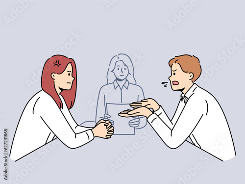 Husband and wife are arguing in lawyer office arguing out relationship during filing of documents for divorce. Married couple turned to lawyer to resolve conflict and help in division of property