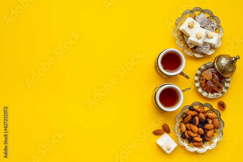 Ramadan party table with tea and sweets. Muslim holiday background