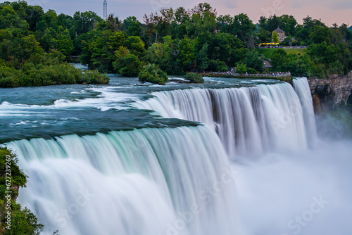 A long exposure photo of the American - Canadian waterfalls Niagara Falls in the evening.