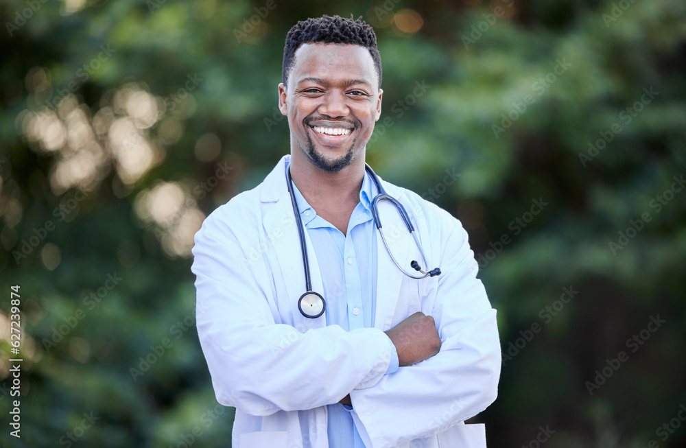 Black man, doctor portrait and arms crossed of healthcare and wellness professional outdoor. Success, motivation and African male person in nature with a smile from career confidence and work