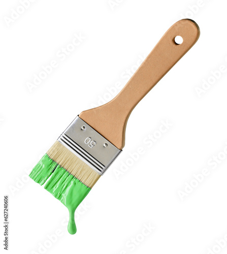 Paintbrush with dripping green paint isolated over white background