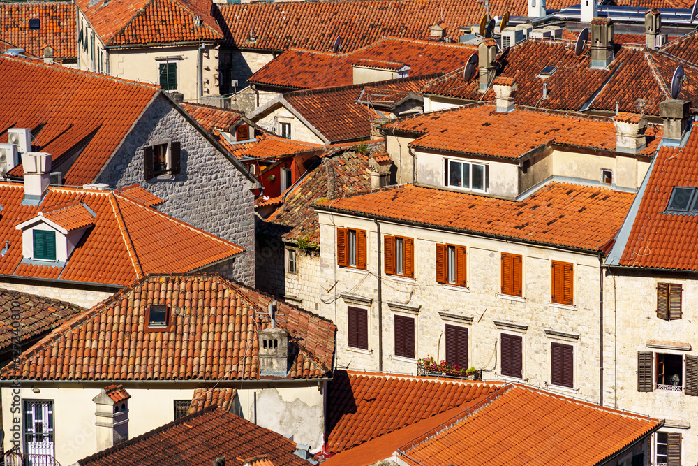 top view of the old town of Kotor in Montenegro, medieval European architecture, city streets, red tiled roofs, the concept of traveling across the Balkans