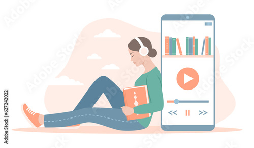 A woman listening to an audio book. A young woman in headphones with a book sitting near a large smartphone with an audiobook app on the screen. Flat vector illustration