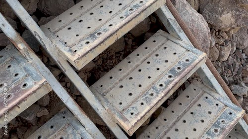 scaffold stair installed on a dirt slope in a mining quarry