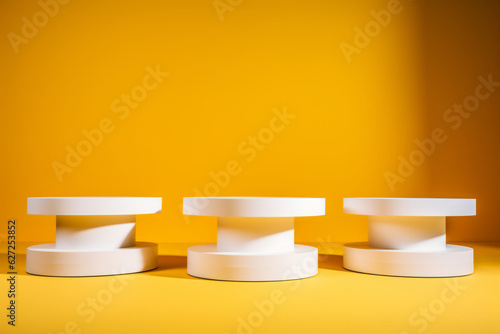 Podium, Pedestal Display for Product Placement. Product Presentation Backdrop. White Cylinder Stand and Yellow Background. generative ai photo