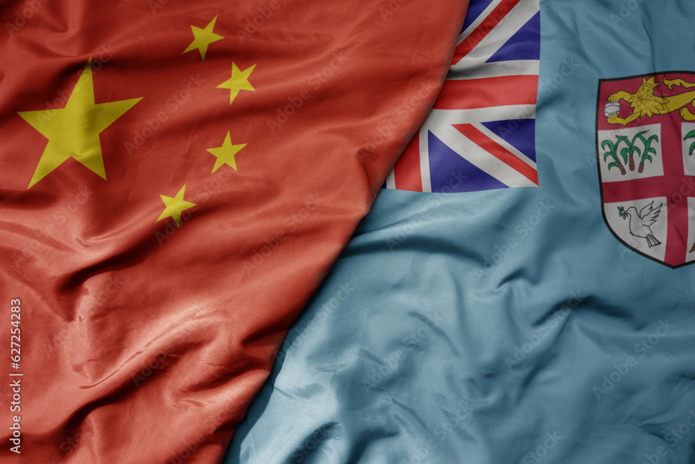 big waving national colorful flag of china and national flag of Fiji . big waving national colorful flag of china and national flag of Fiji .