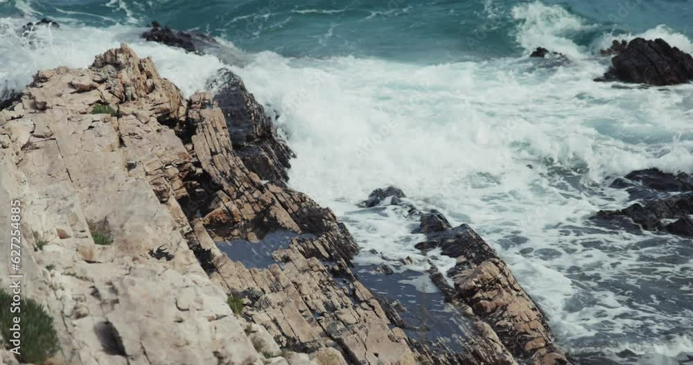 Jugo wind and waves on the rocky coast of the Adriatic Sea, Croatia Jugo wind and waves on the rocky coast of the Adriatic Sea, Croatia