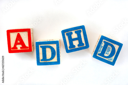 ADHD in kids letter blocks on white photo