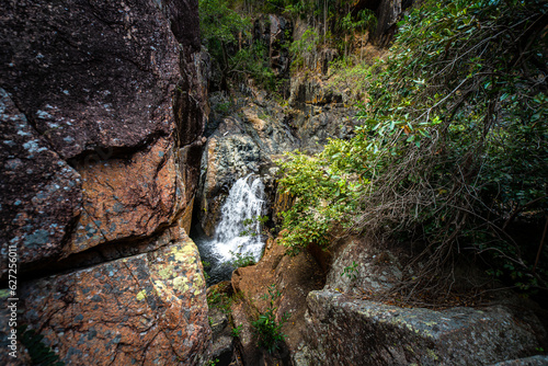 panorama of jourama falls in paluma range national park, north queensland, australia; cascade of numerous powerfull tropical waterfalls near townsville and ingham photo