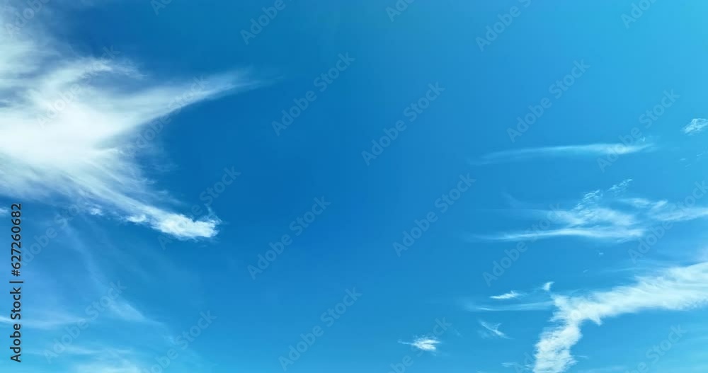 The sky was a brilliant blue, dotted with white clouds that moved gracefully across the sky..The wind gently blew them to and fro, seemingly without direction. .abstract sky nature background. The sky was a brilliant blue, dotted with white clouds that moved gracefully across the sky..The wind gently blew them to and fro, seemingly without direction. .abstract sky nature background.