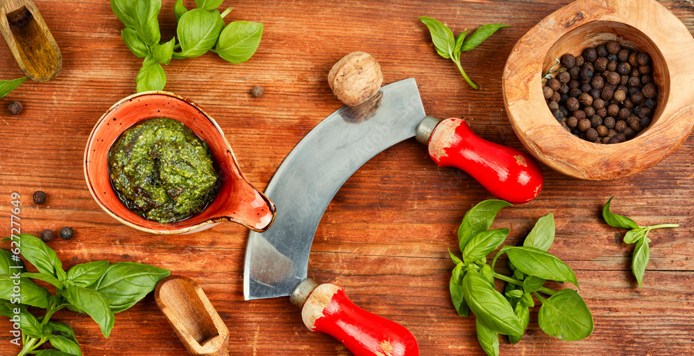 Homemade pesto sauce and ingredients. Homemade pesto sauce and ingredients.