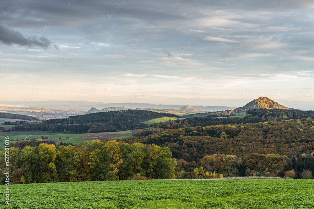 Panoramic view over the autumn volcanic landscape Hegau with the Hohenkraehen, Hohentwiel and Hohenhewen, on the horizon the Swiss Alps, Baden-Wuerttemberg, Germany