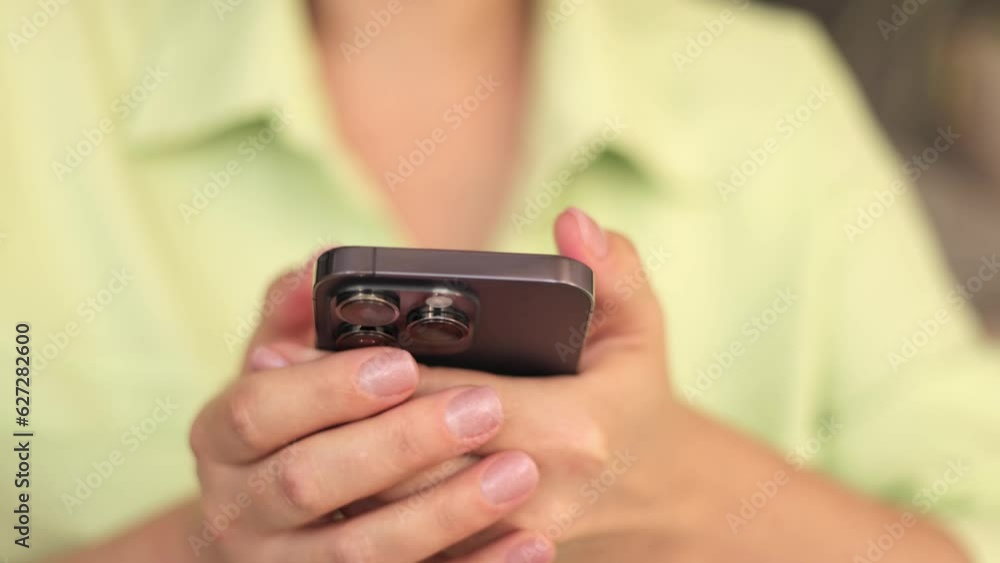 Smartphone in female hands. Close-up of a phone. Smartphone in female hands. Close-up of a phone.