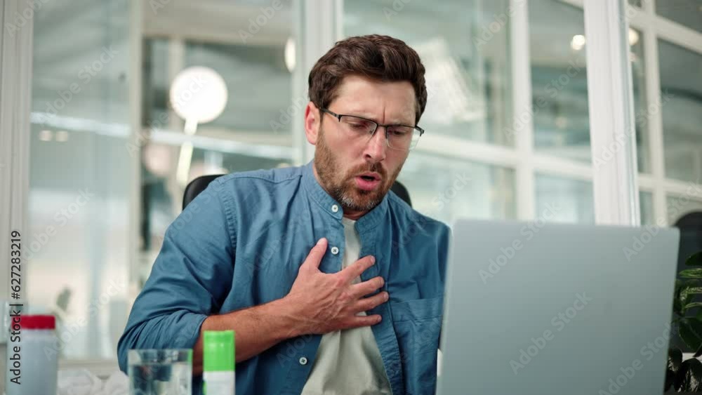 Closeup of working bearded man in glasses, difficulty breathing or chest pain, touches his chest with hand. Heart attack, thoracic osteochondrosis, panic attack concept. Trouble breathing, chest pain. Closeup of working bearded man in glasses, difficulty breathing or chest pain, touches his chest with hand. Heart attack, thoracic osteochondrosis, panic attack concept. Trouble breathing, chest pain.