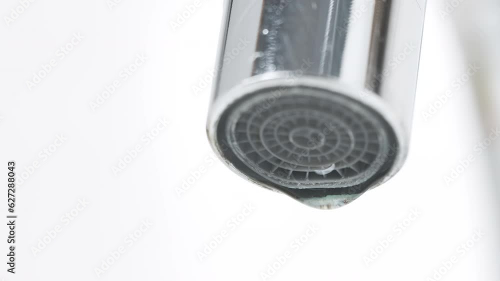 Water Flowing from the Tap in Bathroom. Macro Shot of Faucet. Turning On and Off Water for Using. Useful for Water Consumption, Ecological Problems and Drought Concept. Interior Real Time Prores 422. Water Flowing from the Tap in Bathroom. Macro Shot of Faucet. Turning On and Off Water for Using. Useful for Water Consumption, Ecological Problems and Drought Concept. Interior Real Time Prores 422.