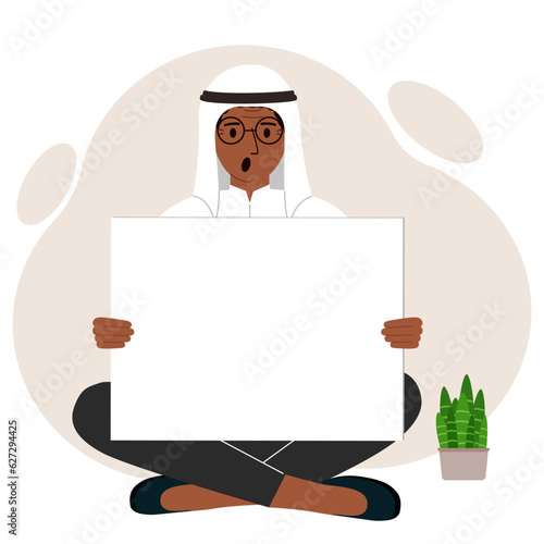 A man sits cross-legged and holds a large white sheet with space for text. Advertising, poster, information, announcement.
